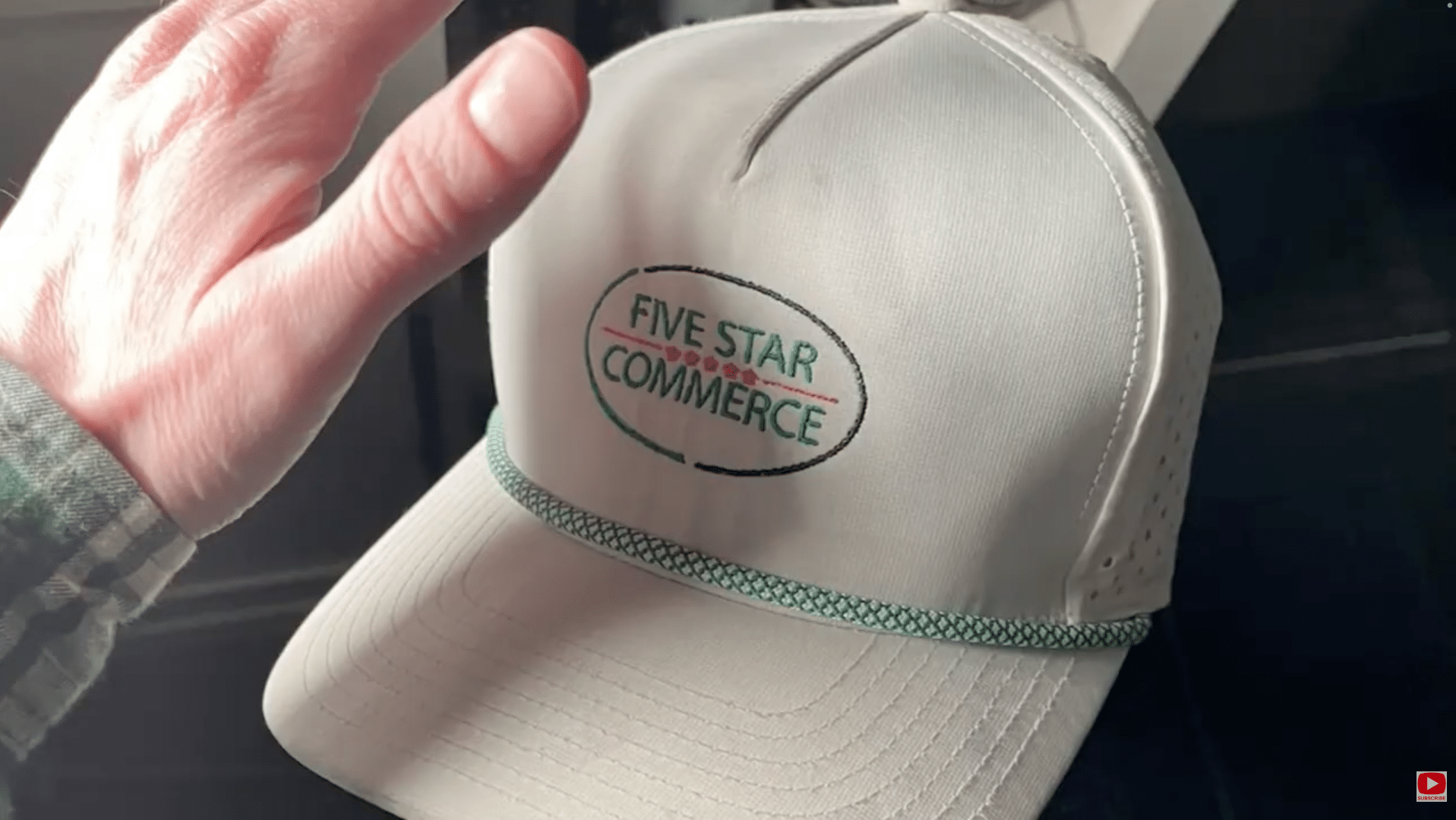 Hand visible in product photo showing real branding